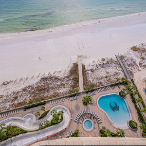 Discover the refreshing pool area with gradual entry, indoor hot tubs and pool, lazy river, and waterslide