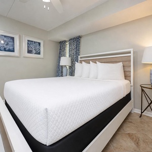 This guest bedroom features a king bed, stylish decor, and natural light from the window, creating a serene retreat