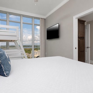 Rest on the soft bed, turn on the wall TV, and watch the gulf through the tall panoramic windows