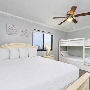 Queen bed in the guest suite invites restful nights while the twin bunks with a trundle welcome cozy family stays