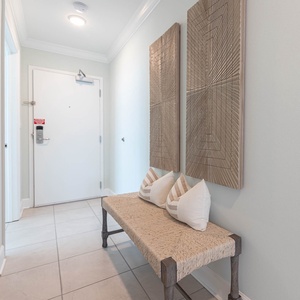 Welcoming entryway invites you to explore this charming vacation rental on the beach