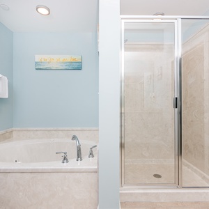 Indulge in relaxation with a jetted tub and a spacious walk-in shower, complemented by soft towels