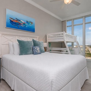 Enjoy stunning beach views from this guest suite with a queen bed and a twin over double bunk