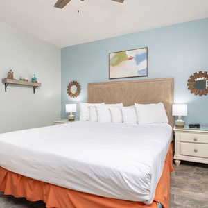 Relax in this inviting bedroom with a king bed, soothing decor, and natural light from the window