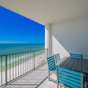 Balcony view with turquoise seating, perfect for relaxing by the beach