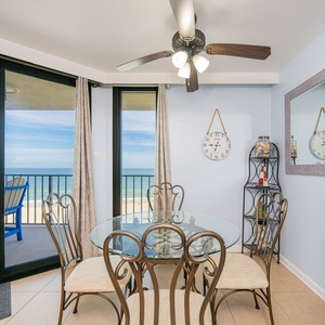 Gentle ceiling fan hums above your dining room where sunlight warms your view of the gulf coast