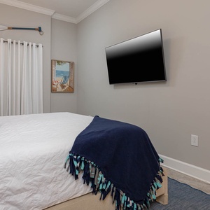 Unwind in the king master suite after a day at the beach and stream your favorite show