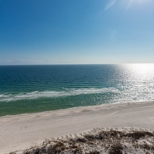 Gaze at the tranquil waters and gentle waves from your beachfront balcony, perfect for relaxation and enjoyment