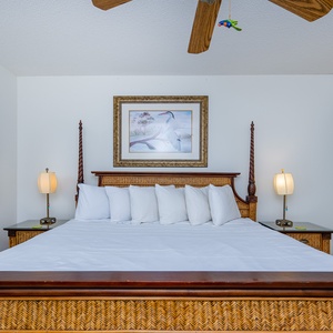 Spacious master bedroom featuring a king-size bed, elegant decor, and soothing lighting for restful nights