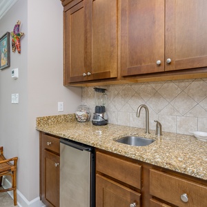 Craft refreshing drinks at the wet bar, perfect for enjoying while unwinding after a day at the coast