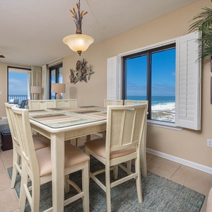 Dine at the table while enjoying panoramic views of the coast through large windows that invite natural light