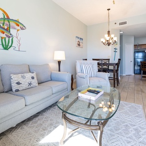 Unwind on the comfortable sofa with queen sleeper, surrounded by beach decor and beachfront views