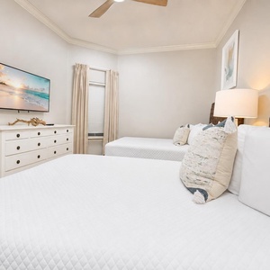Unwind in this queen guest suite and stream your favorite shows or enjoy a good movie after a beach day
