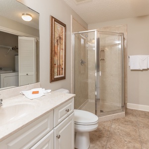 Refresh in this additional guest bath with a walk-in shower and laundry area with a washer and dryer in your rental