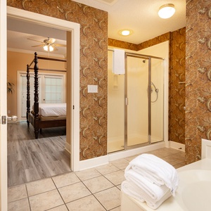 Step into the inviting master bath, where comfort awaits with a walk-in shower and a soothing jetted tub