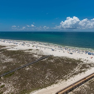 Gaze at the beautiful coast while lounging on your balcony, soaking in the sun and gentle breezes