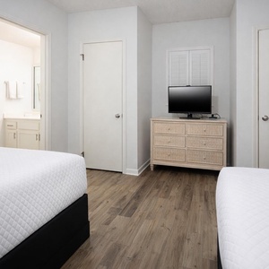 Unwind in this guest suite with two double beds and enjoy a good movie after a beach day