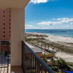 Savor the fresh gulf air on the balcony while enjoying views of the inviting beach area