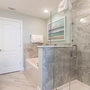 Indulge in relaxation in the master bath with a refreshing walk-in shower and soothing jetted tub