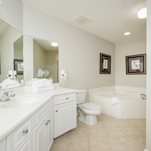 Refresh in the master bath after a day of adventure with a soothing jetted tub and relaxing walk-in shower