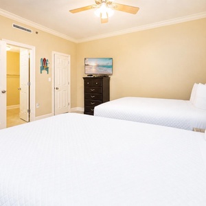 The guest suite offers restful nights on two queen beds with a TV ready for your favorite shows