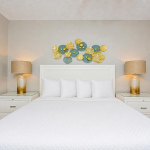 Calm your mind in the guest suite with a queen bed where warm lamps glow beside the bed