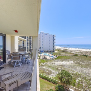Balcony seating offers a relaxing spot to enjoy views of the beach along the shoreline to the jetties in the distance