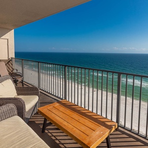 Enjoy the comfortable seating of the balcony while relaxing with expansive views of the tranquil waters and shoreline