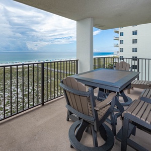 Balcony seating offers a relaxing view of the beach and gulf, perfect for enjoying meals or morning coffee outdoors