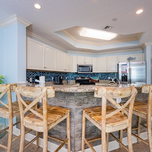 Enjoy casual mornings at the breakfast bar, sipping coffee and savoring the beach vibe in this welcoming kitchen space