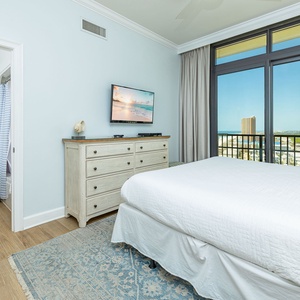 Gaze out at breathtaking views from your king bed, letting the coastal vibe wash over you in this guest bedroom