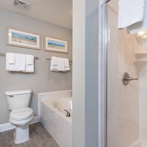 Indulge in relaxation in the master bath with a refreshing walk-in shower and soothing jetted tub