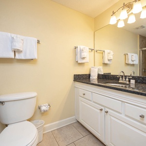 Refresh in the guest bathroom featuring a spacious vanity, soft towels, and a convenient shower area for your comfort