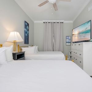 Relax on one of the cozy queen beds in this guest suite and enjoy a restful retreat
