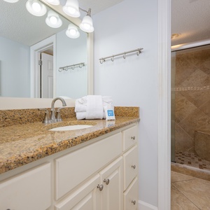 Revitalize your senses in the master bathroom, where fluffy towels and elegant fixtures await your relaxation