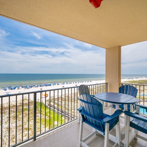 Savor your morning coffee at the table while enjoying sweeping views of the beach and vibrant blue skies