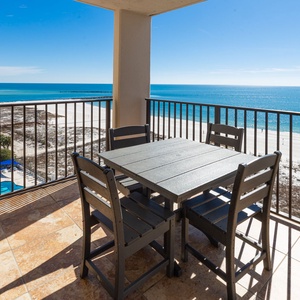 Enjoy time on the balcony overlooking the tranquil waters and beach