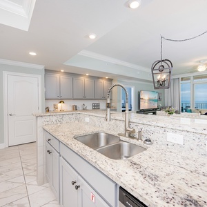 Upgrade your culinary experience in this elegant kitchen with modern touches and spacious counters