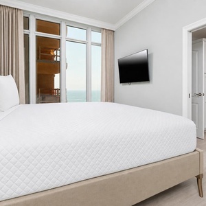 Relax on the cozy king bed in this guest suite and stream your favorite shows after a beach day