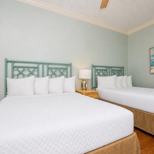 Relax on one of the cozy queen beds in this guest suite and enjoy a peaceful slumber
