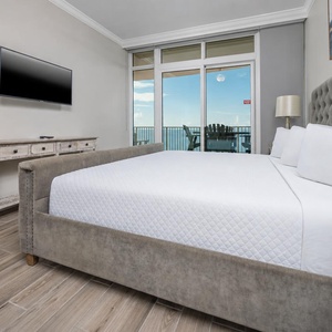 Sink into the plush king bed in the master, enveloped in softness, as coastal sounds lull you into a restful sleep