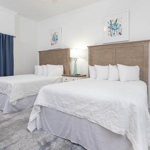 Unwind in the queen guest suite and read by the lamp beneath beach artwork for a quiet night