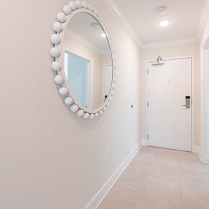 Step into the entryway of this charming beach vacation rental awaiting your arrival