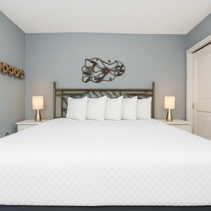 This serene bedroom features a plush king bed and soft lighting for a relaxing retreat
