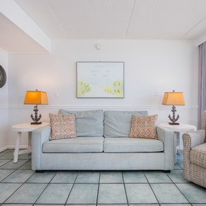 Sink into the sofa with a queen sleeper, surrounded by soft lighting and cheerful decor, as you enjoytime with family