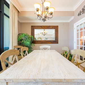 Relax and enjoy laughter with family around the inviting dining table as you take in the coastal views