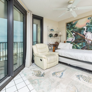 Sink into the comfy recliner and gaze at the beach view while basking in the vibrant coastal decor