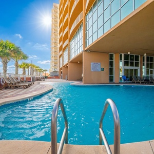 Take a refreshing dip and soak up the sunshine at the inviting outdoor pool, the perfect place to relax and enjoy your vacation