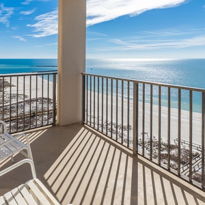 Relax on the balcony enjoying expansive views of the tranquil waters and the shoreline below
