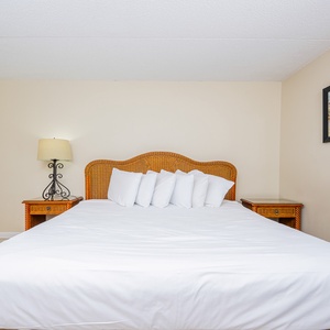 This bedroom features a comfortable bed with plush pillows, perfect for a restful sleep